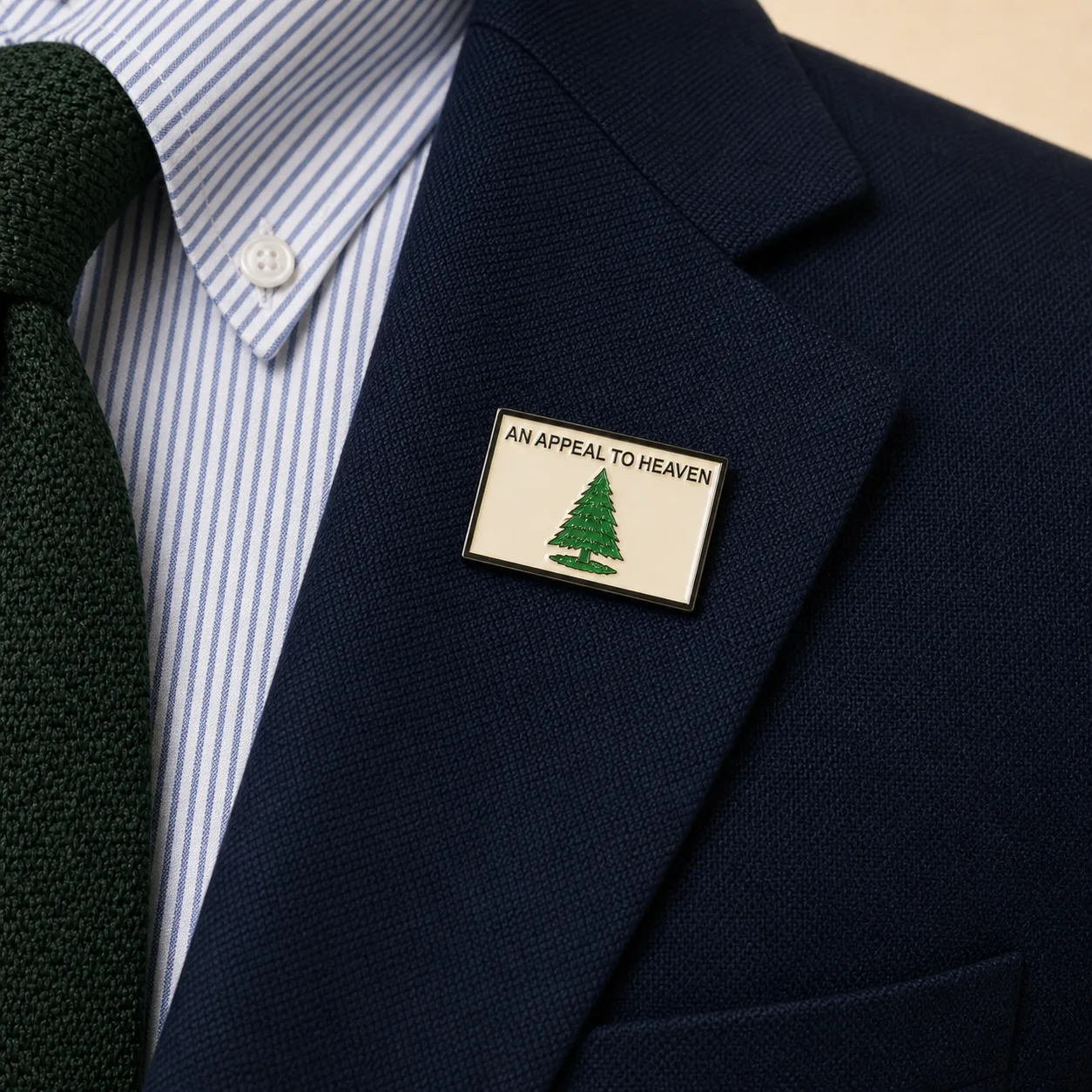 An Appeal to Heaven 2.0 lapel pin worn on the navy blazer