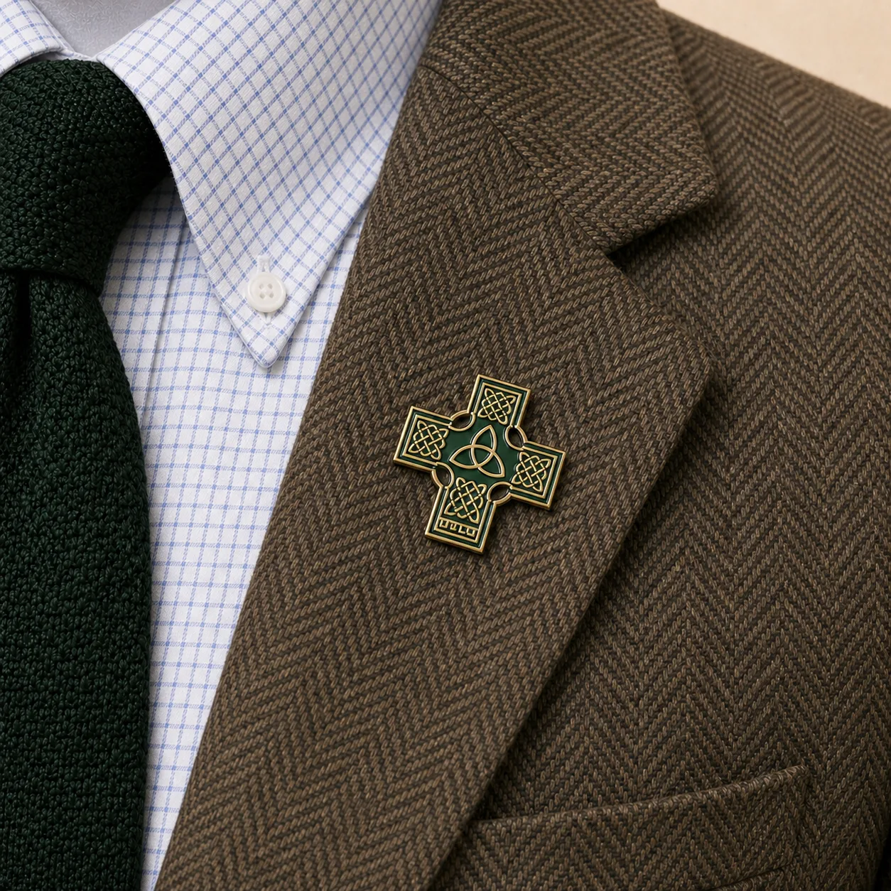 Celtic Cross / Trinity Knot lapel pin worn on the brown herringbone blazer